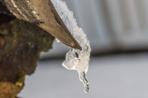 A roof in Winter, Roofing Company Basingstoke are able to clear snow ice and frost from gutters